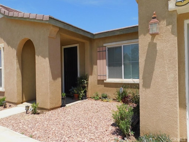 10947 Mesa Linda St, Victorville, CA 92392 - doorway to property with stucco siding