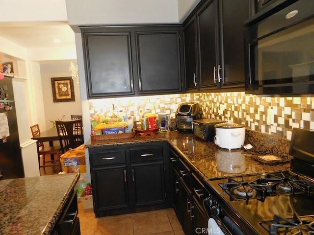 10947 Mesa Linda St, Victorville, CA 92392 - kitchen featuring black appliances, dark cabinets, and backsplash
