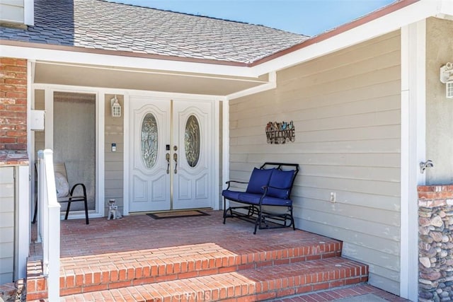 2001 Cypress Point Dr, Corona, CA 92882 - property entrance featuring a shingled roof, covered porch, and brick siding