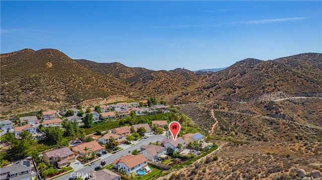 31868 Birchwood Dr, Lake Elsinore, CA 92532 - aerial overview of property's location with a mountainous background and nearby suburban area