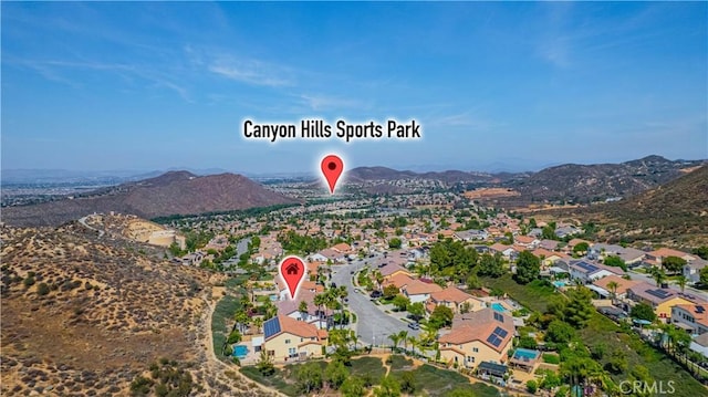 31868 Birchwood Dr, Lake Elsinore, CA 92532 - aerial view of residential area featuring a mountainous background