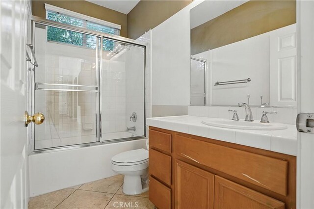 31868 Birchwood Dr, Lake Elsinore, CA 92532 - full bath with vanity, shower / bath combination with glass door, and tile patterned flooring