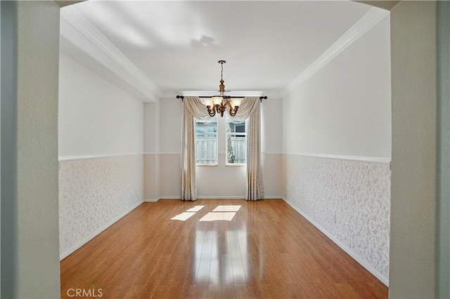 31868 Birchwood Dr, Lake Elsinore, CA 92532 - unfurnished dining area featuring a chandelier, wood finished floors, and ornamental molding