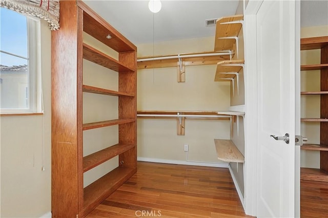 31868 Birchwood Dr, Lake Elsinore, CA 92532 - walk in closet featuring wood finished floors