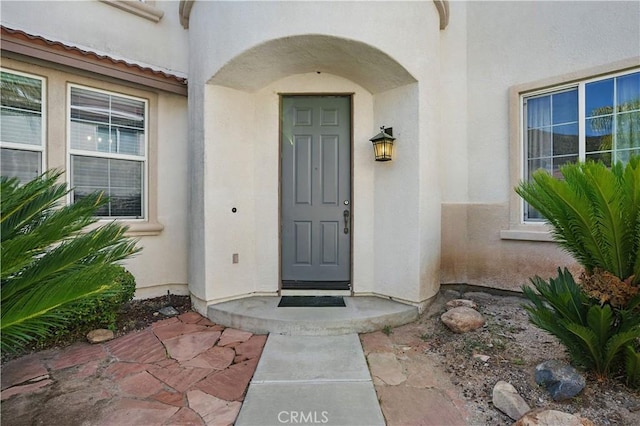 31868 Birchwood Dr, Lake Elsinore, CA 92532 - view of exterior entry featuring stucco siding