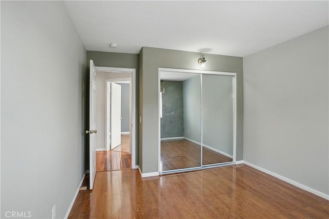31868 Birchwood Dr, Lake Elsinore, CA 92532 - unfurnished bedroom featuring wood finished floors and a closet