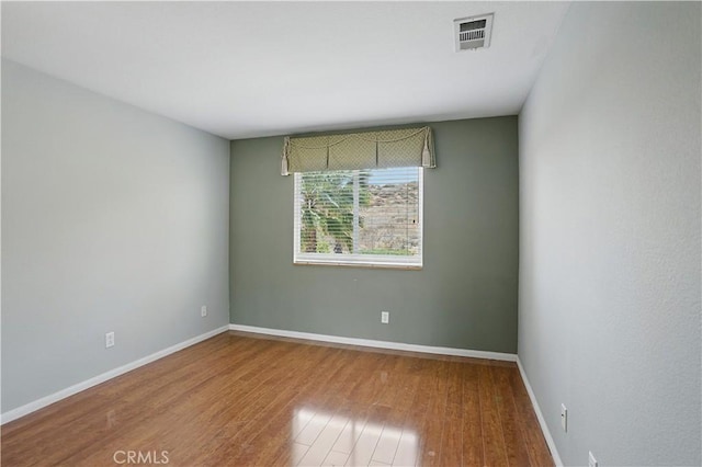 31868 Birchwood Dr, Lake Elsinore, CA 92532 - empty room with baseboards and wood finished floors