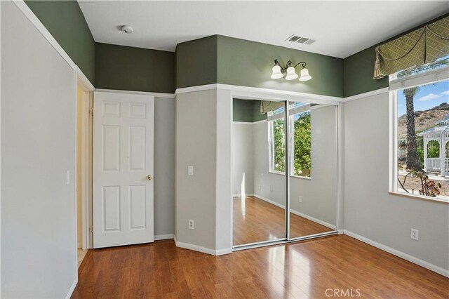 31868 Birchwood Dr, Lake Elsinore, CA 92532 - unfurnished bedroom with wood finished floors and baseboards