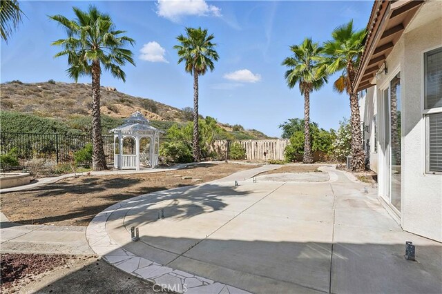 31868 Birchwood Dr, Lake Elsinore, CA 92532 - fenced backyard featuring a gazebo, a mountain view, and a patio area