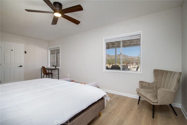 4574 Avenida Del Sol, Joshua Tree, CA 92252 - bedroom featuring wood finished floors and a ceiling fan