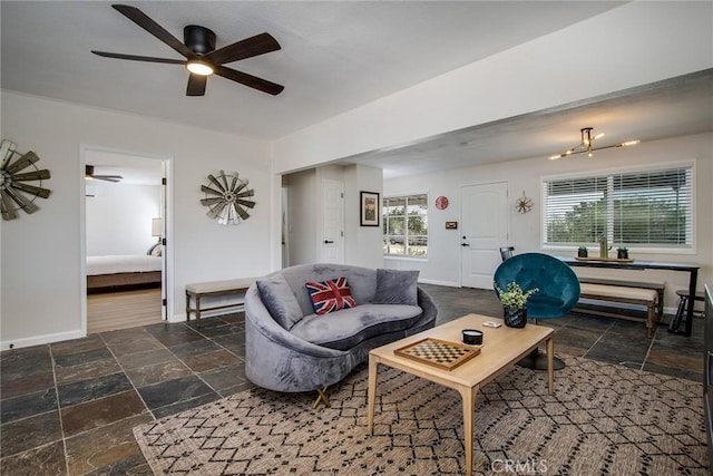 4574 Avenida Del Sol, Joshua Tree, CA 92252 - living room with stone tile floors and a ceiling fan