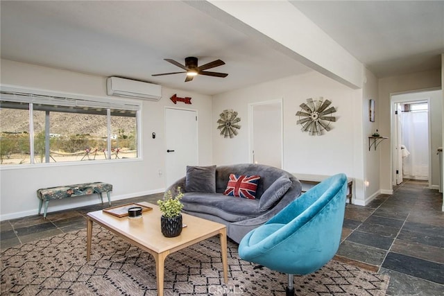 4574 Avenida Del Sol, Joshua Tree, CA 92252 - living room with a wall mounted AC, stone tile floors, a ceiling fan, and healthy amount of natural light