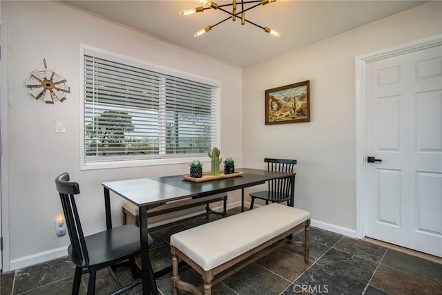 4574 Avenida Del Sol, Joshua Tree, CA 92252 - dining area featuring a chandelier and stone tile floors