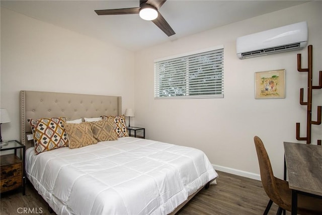4574 Avenida Del Sol, Joshua Tree, CA 92252 - bedroom with a wall mounted AC, wood finished floors, and a ceiling fan