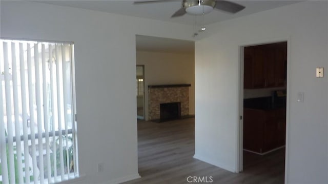 708 N Montebello Blvd, Montebello, CA 90640 - empty room featuring a ceiling fan, wood finished floors, and a fireplace