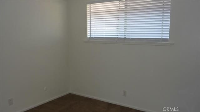 708 N Montebello Blvd, Montebello, CA 90640 - empty room featuring baseboards and dark carpet