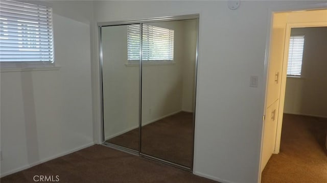 708 N Montebello Blvd, Montebello, CA 90640 - unfurnished bedroom featuring carpet, a closet, and multiple windows