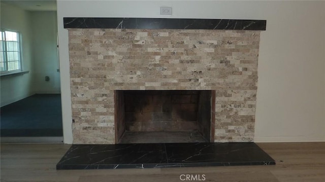 708 N Montebello Blvd, Montebello, CA 90640 - detailed view of wood finished floors and a fireplace with raised hearth