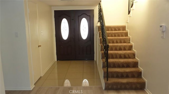 708 N Montebello Blvd, Montebello, CA 90640 - foyer entrance with stairway and light tile patterned flooring