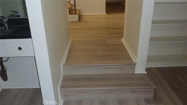 708 N Montebello Blvd, Montebello, CA 90640 - stairs featuring wood finished floors and baseboards
