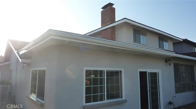 708 N Montebello Blvd, Montebello, CA 90640 - view of property exterior featuring stucco siding and a chimney