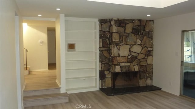 708 N Montebello Blvd, Montebello, CA 90640 - detailed view of wood finished floors, a stone fireplace, and recessed lighting
