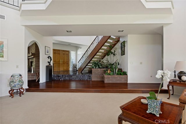 30833 La Solana Ct, Redlands, CA 92373 - entrance foyer featuring stairway, carpet flooring, and arched walkways