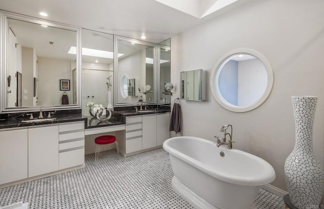 7487 Via De Fortuna, Carlsbad, CA 92009 - full bathroom featuring double vanity, a freestanding tub, a shower stall, and tile patterned floors