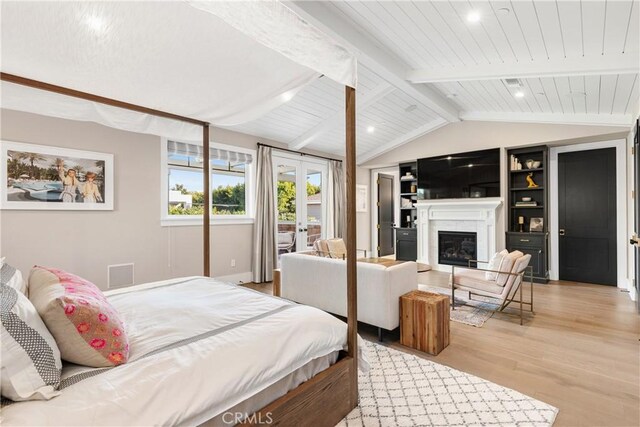 4164 Sunnyslope Ave, Sherman Oaks, CA 91423 - bedroom with french doors, light wood-style floors, a glass covered fireplace, and wooden ceiling