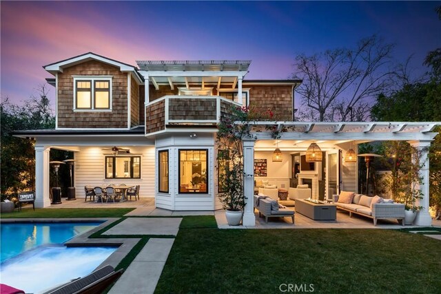 4164 Sunnyslope Ave, Sherman Oaks, CA 91423 - back of house at dusk featuring outdoor lounge area, a balcony, a pergola, and a patio area