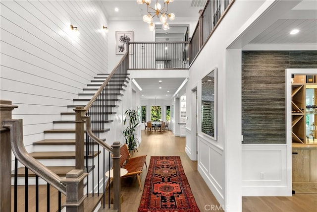 4164 Sunnyslope Ave, Sherman Oaks, CA 91423 - foyer with stairs, wood finished floors, a chandelier, crown molding, and a towering ceiling