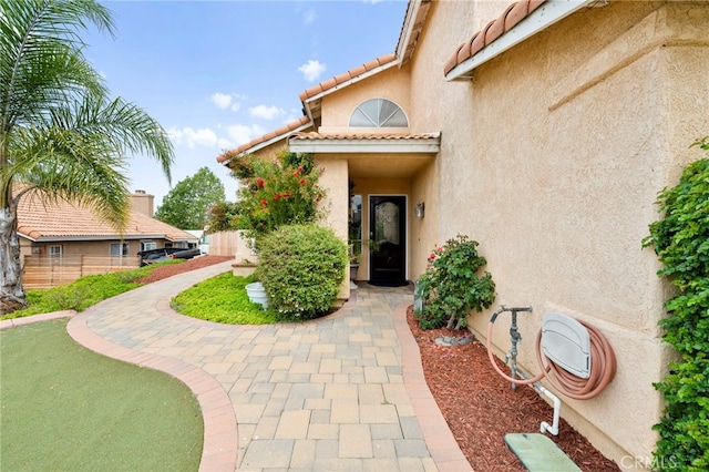 29678 Deal Ct, Temecula, CA 92591 - property entrance with stucco siding and a tile roof