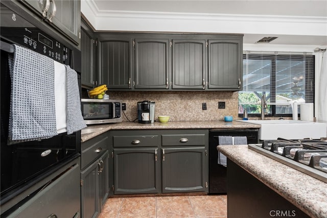 3367 M St, Merced, CA 95348 - kitchen with refrigerator, stainless steel microwave, light tile patterned flooring, dishwashing machine, and light countertops