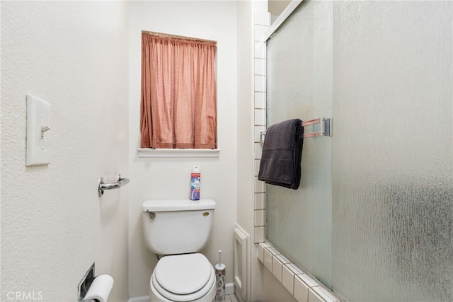 3367 M St, Merced, CA 95348 - bathroom with toilet and baseboards