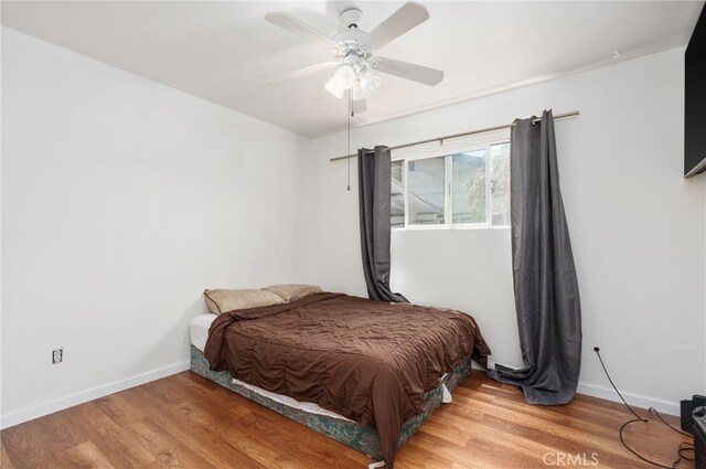 3367 M St, Merced, CA 95348 - bedroom with wood finished floors and a ceiling fan