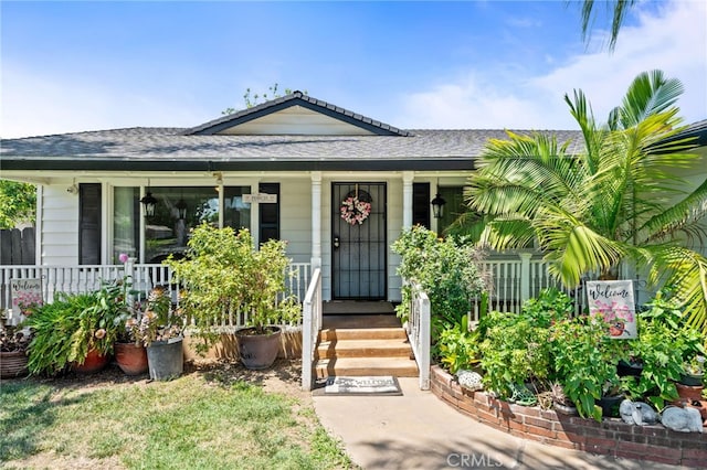 3367 M St, Merced, CA 95348 - view of front of home with covered porch and a shingled roof