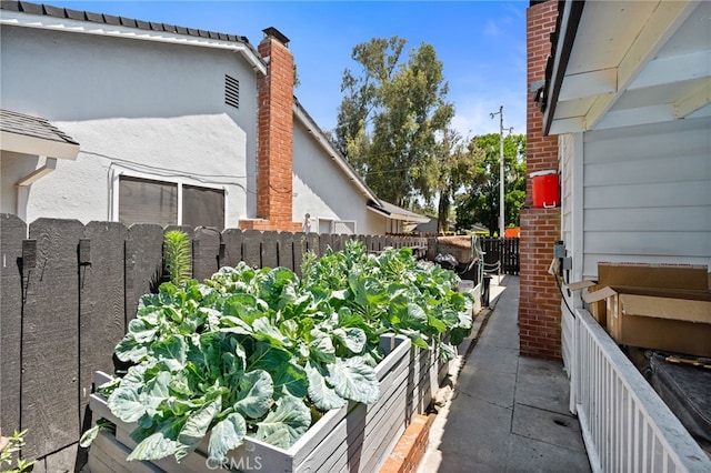 3367 M St, Merced, CA 95348 - view of side of property with a vegetable garden