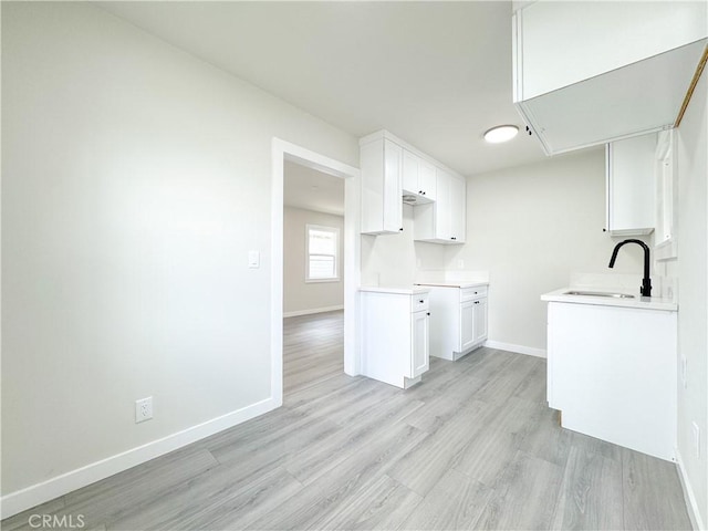 2058 E Stockwell St, Compton, CA 90222 - laundry area featuring attic access and light wood-type flooring
