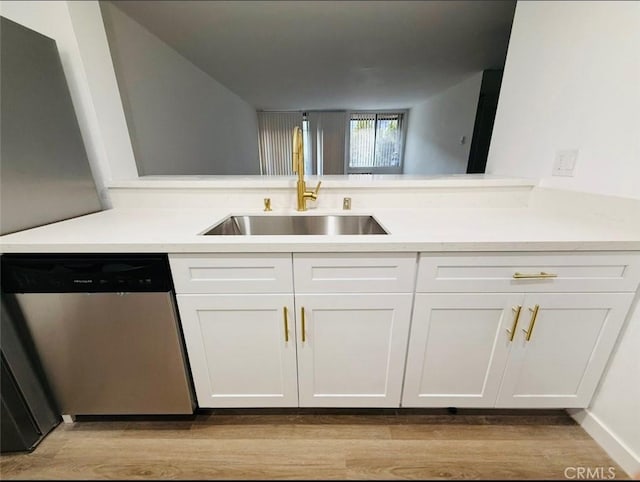 4170 Elm Ave Unit 213, Long Beach, CA 90807 - kitchen featuring stainless steel dishwasher, light wood finished floors, and white cabinetry