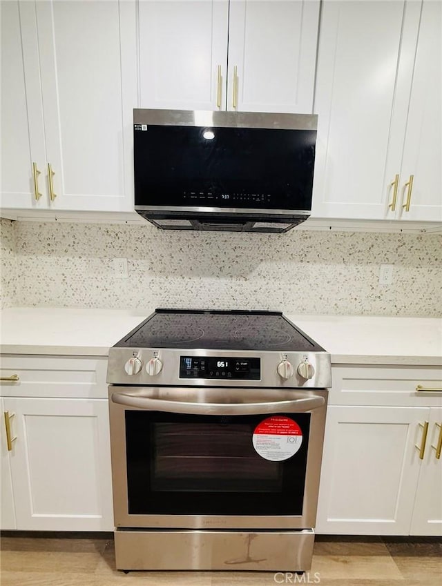 4170 Elm Ave Unit 213, Long Beach, CA 90807 - kitchen with stainless steel appliances, light countertops, and white cabinetry