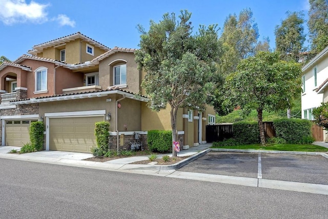 6925 Tourmaline, Carlsbad, CA 92009 - townhome / multi-family property featuring stucco siding, stone siding, a tiled roof, and a garage