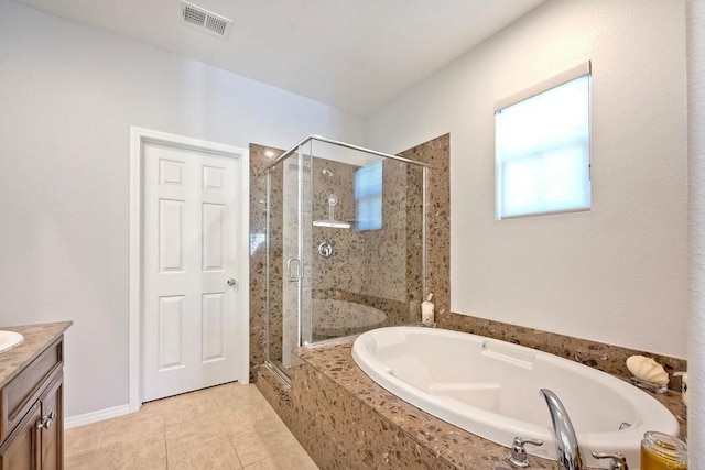 6925 Tourmaline, Carlsbad, CA 92009 - bathroom with vanity, a garden tub, a shower stall, and tile patterned flooring
