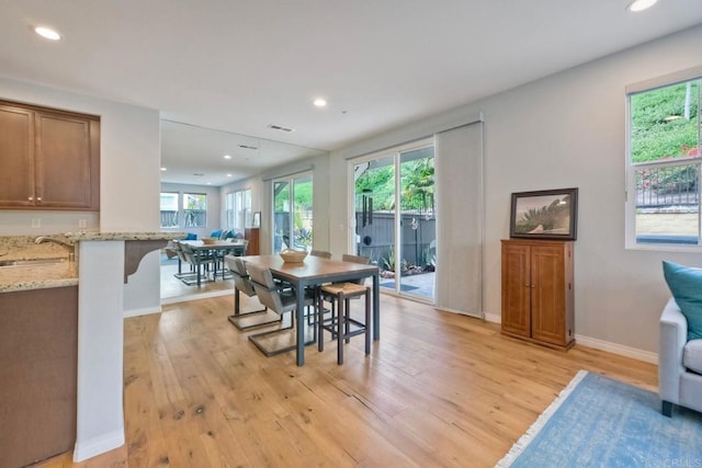 6925 Tourmaline, Carlsbad, CA 92009 - dining room with light wood-style flooring and recessed lighting