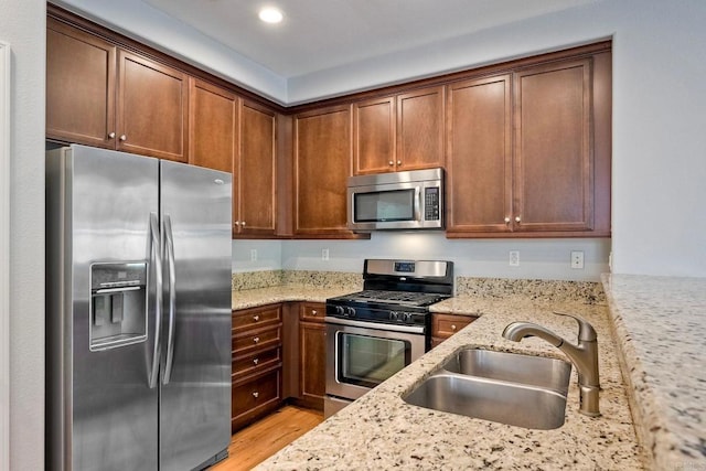 6925 Tourmaline, Carlsbad, CA 92009 - kitchen with appliances with stainless steel finishes, light wood-style flooring, light stone counters, and recessed lighting