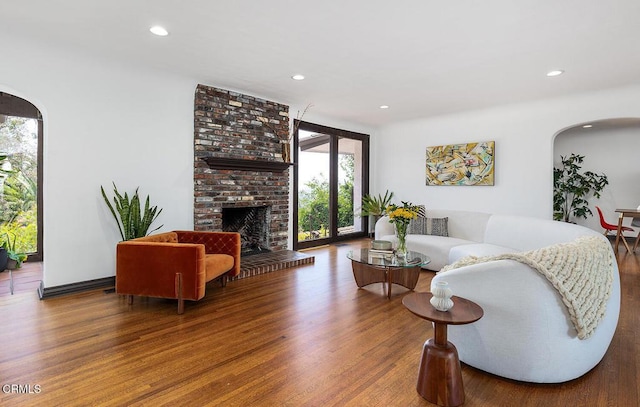 405 Sequoia Dr, Pasadena, CA 91105 - living area featuring arched walkways, wood finished floors, recessed lighting, and a fireplace