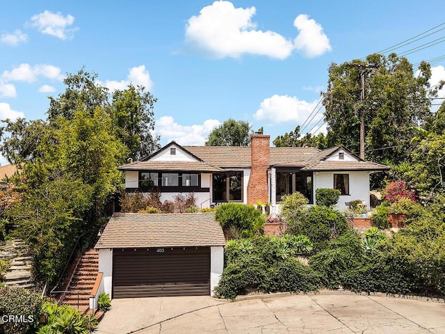405 Sequoia Dr, Pasadena, CA 91105 - view of front of home featuring concrete driveway, stucco siding, a chimney, an attached garage, and stairs