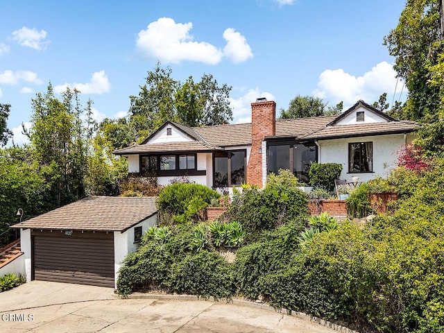 405 Sequoia Dr, Pasadena, CA 91105 - view of front of home featuring stucco siding, a chimney, concrete driveway, an outbuilding, and a tile roof