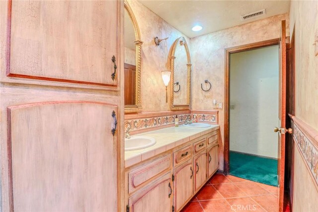 2033 Benbow Pl, Riverside, CA 92506 - full bathroom with double vanity and tile patterned flooring