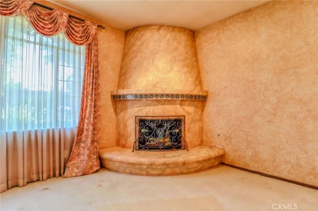 2033 Benbow Pl, Riverside, CA 92506 - unfurnished living room featuring carpet floors and a fireplace with raised hearth