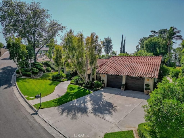 2033 Benbow Pl, Riverside, CA 92506 - mediterranean / spanish home with an attached garage, driveway, a front yard, stucco siding, and a tile roof